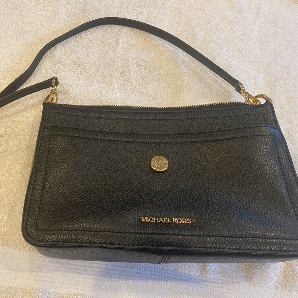 Michael Kors purse. Can be used as crossbody, clutch and removable envelope. New